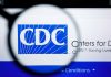 CDC logo magnified on a screen.