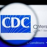 CDC logo magnified on a screen.