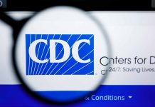 CDC logo magnified on a screen.