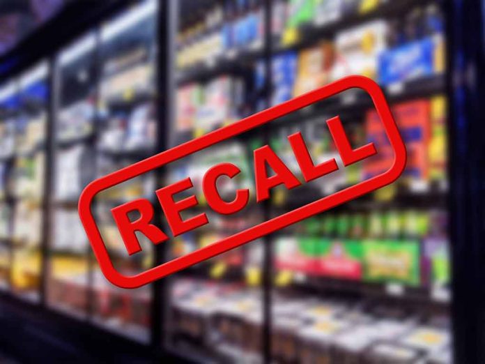 "Recall" stamp over blurred grocery store shelves.