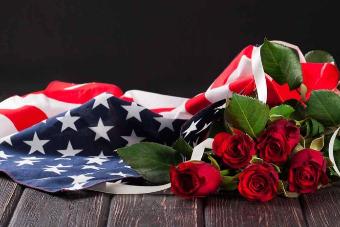 American flag with red roses on dark background