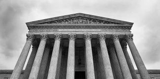 SCOTUS building with large columns and stairs.