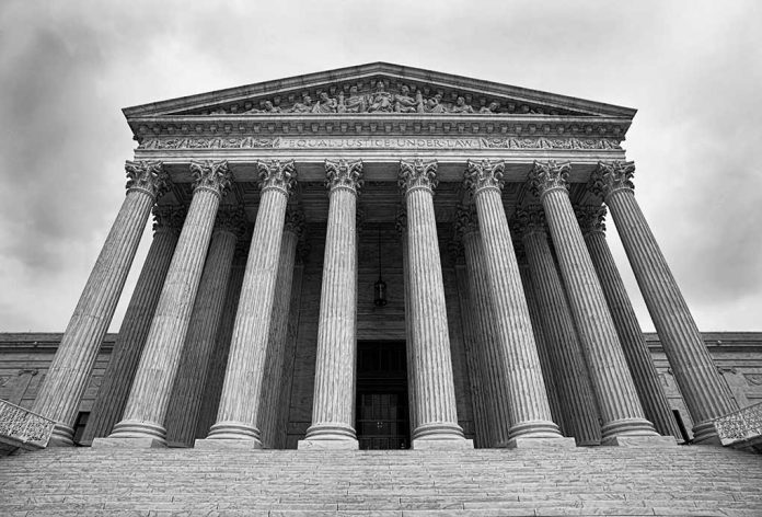 SCOTUS building with large columns and stairs.