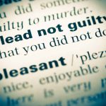 plead not guilty definition in a dictionary