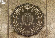 FBI seal on a marble wall.