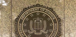 FBI seal on a marble wall.