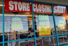 Store closing sale with going out of business signs.