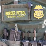 Border Patrol vest with gear and communication equipment.