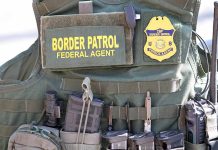 Border Patrol vest with gear and communication equipment.