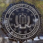 Department of Justice FBI emblem on a wall