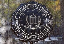 Department of Justice FBI emblem on a wall