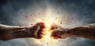 Two fists colliding with sparks and debris.