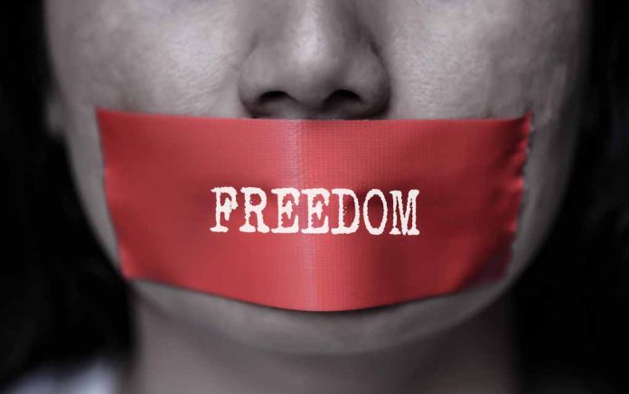 Red tape over mouth with "FREEDOM" text.