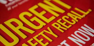 Urgent safety recall sign in bold letters