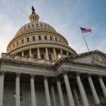 US Capitol building with American flag flying above