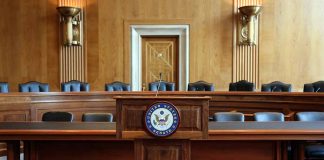 Empty US Senate hearing room with wooden furniture