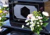 Colorful flowers on a black tombstone