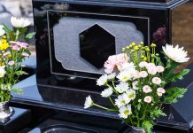 Colorful flowers on a black tombstone