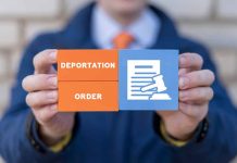 Hands holding deportation order block tiles