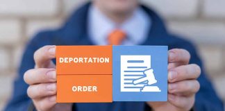 Hands holding deportation order block tiles
