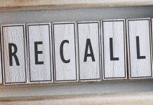 The word RECALL on wooden tiles