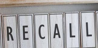The word RECALL on wooden tiles