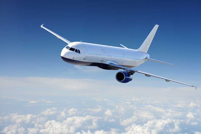 41347264 featured image Airplane flying above the clouds in blue sky