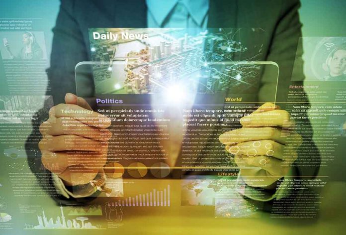 588542129 featured image Person holding transparent tablet displaying digital news content