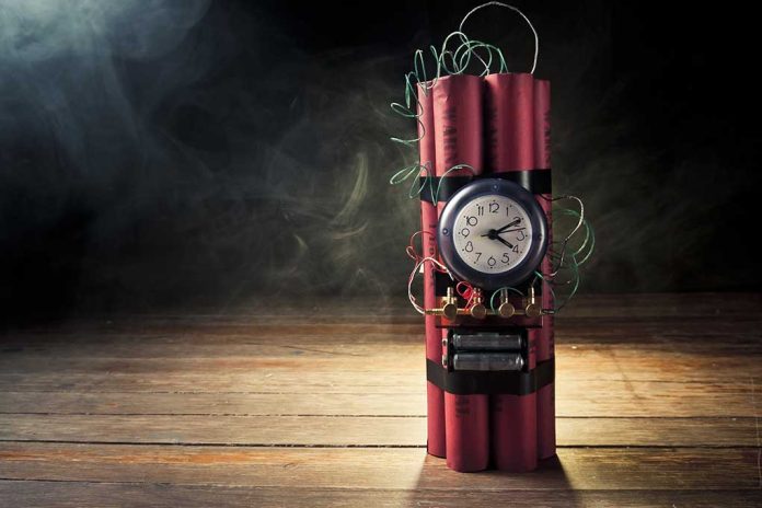 Dynamite bundle with a clock timer on wooden floor