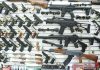 Wall display of various firearms in a store