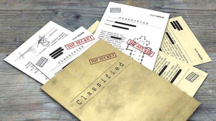 1099529729 featured image Classified documents with Top Secret stamps on wooden surface