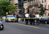 Police gathered at an urban crime scene