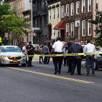 Police gathered at an urban crime scene