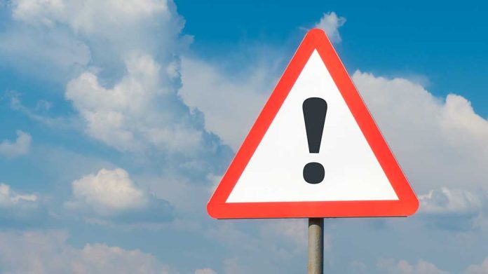1783780781 featured image Warning sign with exclamation mark against cloudy sky