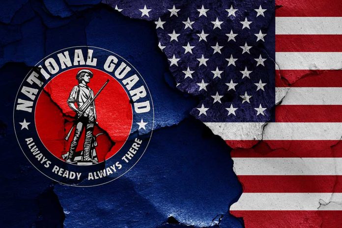 1787937674 featured image "National Guard logo and American flag with cracks."