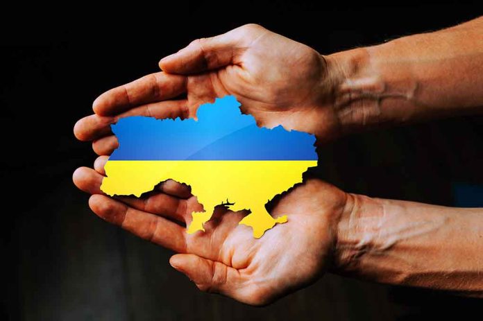 2129047880 featured image Hands holding Ukraine map with flag design