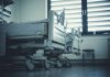 Empty hospital beds by a window