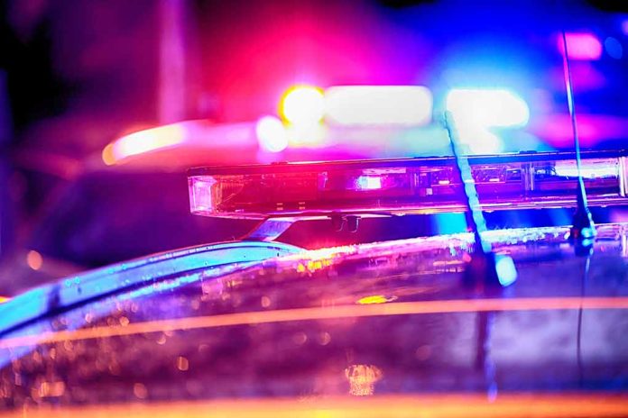 2304350799 featured image Closeup of police car lights flashing at night
