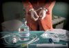 Vial labeled Sodium Thiopental near handcuffed person