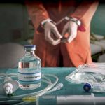 Vial labeled Sodium Thiopental near handcuffed person