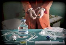 Vial labeled Sodium Thiopental near handcuffed person