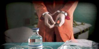 Vial labeled Sodium Thiopental near handcuffed person