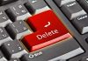 Closeup of a keyboard with red Delete key