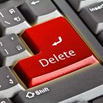 Closeup of a keyboard with red Delete key