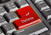 Closeup of a keyboard with red Delete key