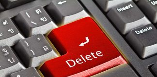 Closeup of a keyboard with red Delete key