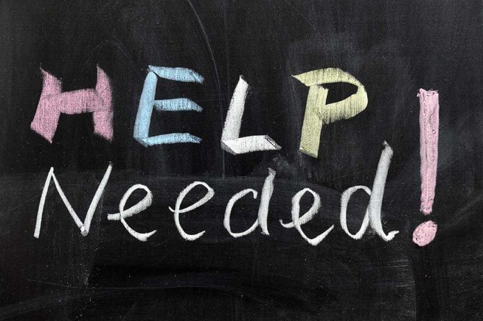 Help Needed written in colorful chalk