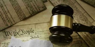 Gavel on 14th Amendment document with Constitution background