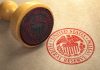 Federal Reserve stamp and wooden stamp on paper