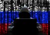 Hacker in hoodie with Russian flag background and code